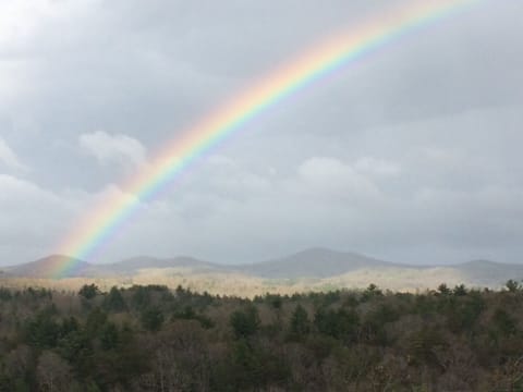 A portion of the panoramic view with a rainbow from the front wrap around porch!