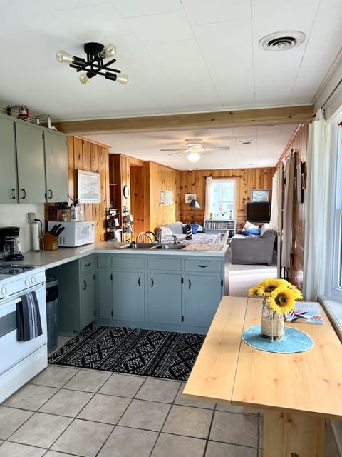 Stocked with utensils, coffee maker, toaster, blender and more. No dishwasher. 