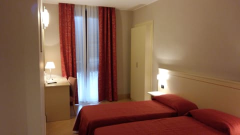 Double or Twin Room | Minibar, desk, blackout drapes, free WiFi