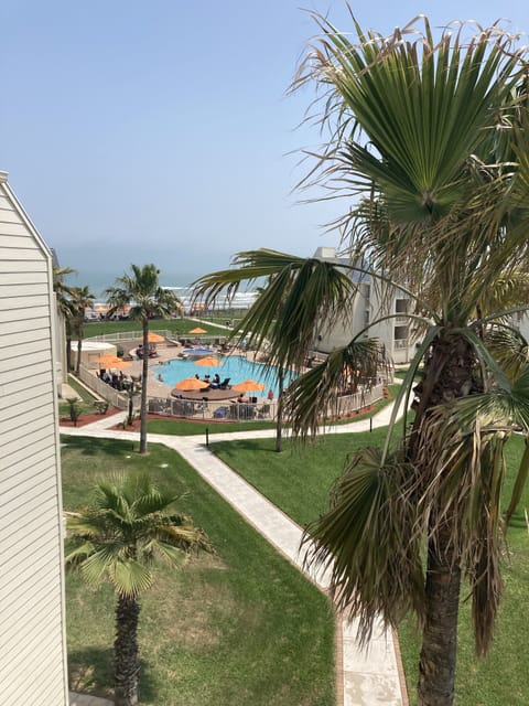view to the pool from the upstairs bedroom balcony