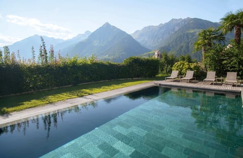 Seasonal outdoor pool, open 6:00 AM to 9:00 PM, pool umbrellas