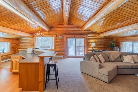 Rich Log Interior with an Open Floor Plan