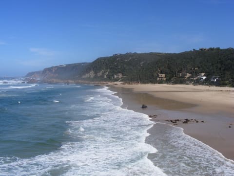 Beach nearby, white sand, sun loungers, beach umbrellas