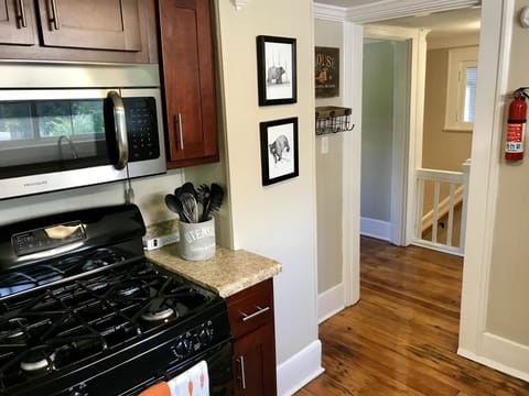 Fully equipped kitchen includes gas stove w/oven, microwave & small appliances.