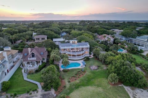 Aerial view of large property with pool and landscaping