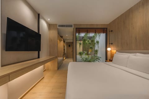 Junior Suite, 1 King Bed, Balcony, Pool View | Minibar, in-room safe, laptop workspace, blackout drapes