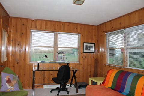 Sunroom with full size futon works as a forth bedroom