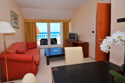 Panoramic Suite, 1 Bedroom, Sea View | Living area | Flat-screen TV