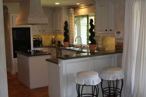 Kitchen-Equipped with 
ice-maker, 2 refrigerators and all cooking needs.