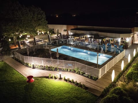 Seasonal outdoor pool, open 9:00 AM to 9:00 PM, pool umbrellas