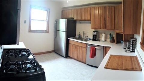 Well-stocked kitchen w/ dishwasher coffee maker, toaster, spices & butcher block
