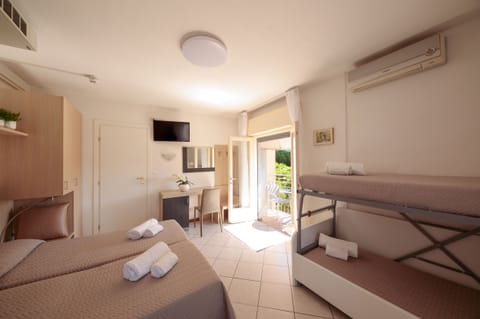 Standard Quadruple Room, Balcony | In-room safe, desk, free WiFi, bed sheets