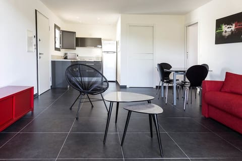 Apartment, 1 Bedroom | Living room | Flat-screen TV