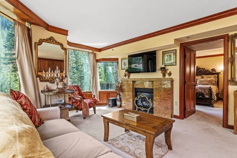 Granite cascading fireplace, king-size American Leather sofa sleeper. 