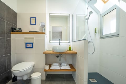 Shower, hair dryer, bathrobes, towels