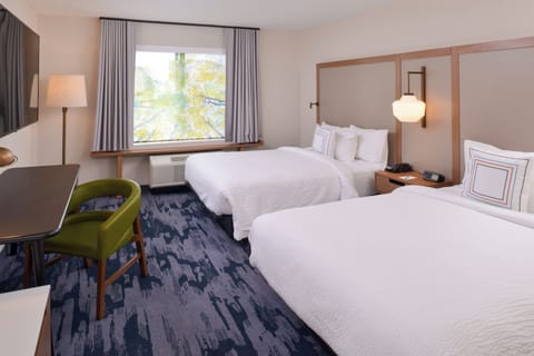 Desk, blackout drapes, iron/ironing board, free cribs/infant beds