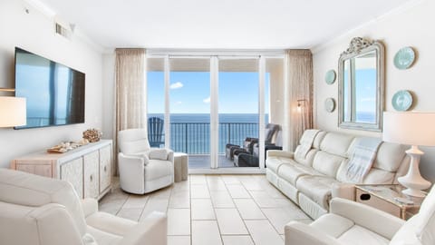 Panoramic oceanfront living room with balcony in luxury Gulf Shores condo