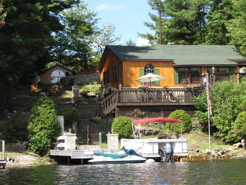 Cottage as viewed from the lake w/bunk house in rear left. Pontoon NOT INCLUDED 