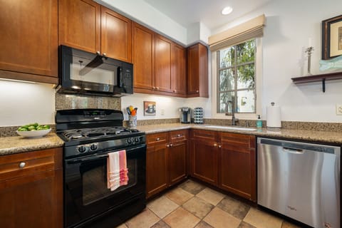 Cook your favorite meals in this well appointed kitchen with granite countertops