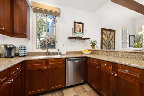 Fully equipped kitchen with granite countertops and stainless steel appliances