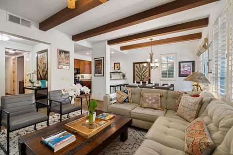 Open concept living room, dining area, kitchen and main entrance