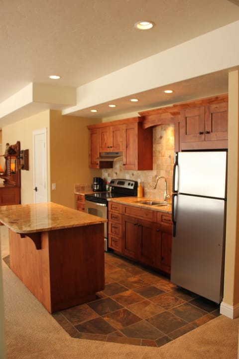 Slate floor and granite countertop makes lower level kitchen top-notch