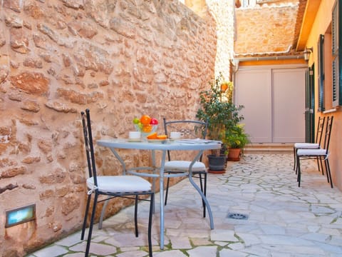 Outdoor dining area at patio with table, chairs