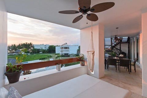 The hammock swing chair on the balcony is a favorite