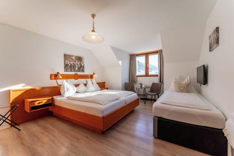 Family Room | Premium bedding, down comforters, in-room safe, desk