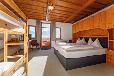 Family Room | Premium bedding, down comforters, in-room safe, desk