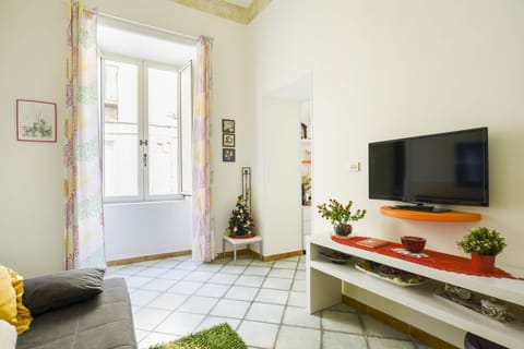 Deluxe Apartment, City View | Living area | Flat-screen TV