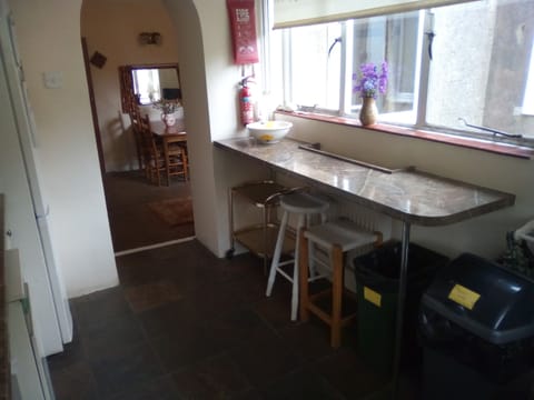 Kitchen with stools and breakfast bar
