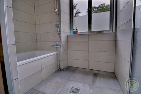 Separate tub and shower, free toiletries, hair dryer, bathrobes