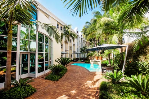 Outdoor pool, pool umbrellas, sun loungers