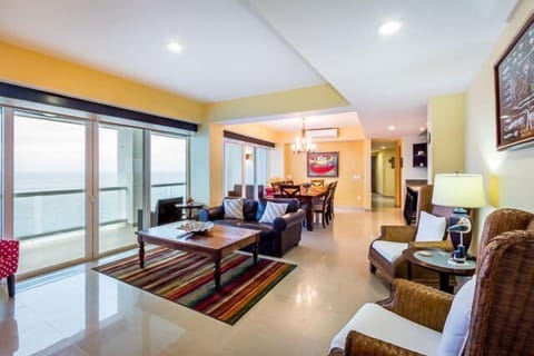 Comfortable living room with adjoining dining room. Both with ocean views.