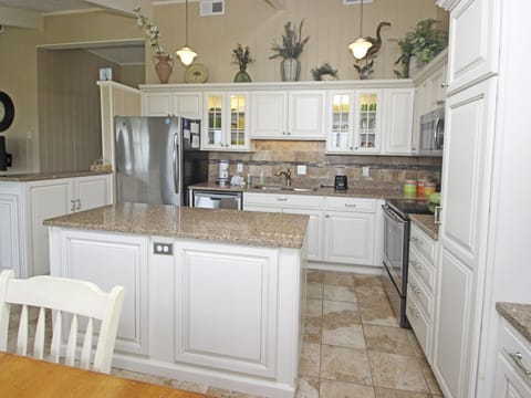New stainless steel appliances, granite countertops, and ceramic flooring