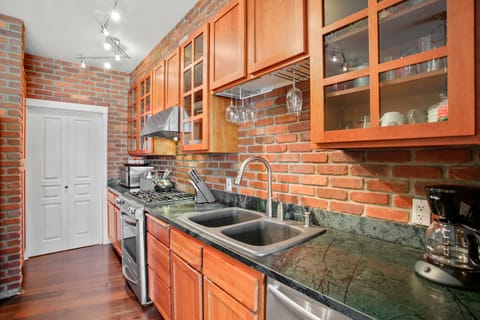 Kitchen Area.  Cherry Cabinets, Soap Stone Counter Tops & Gas Range
