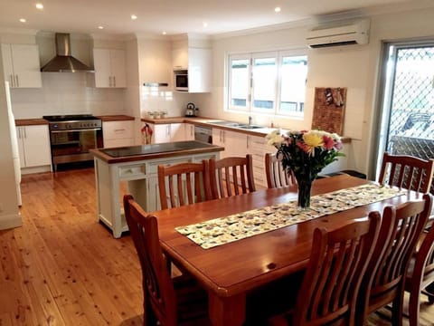 The large fully equipped kitchen and dining area.
