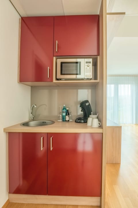 Deluxe Room, 1 Double Bed, Kitchenette | Minibar, in-room safe, blackout drapes, soundproofing