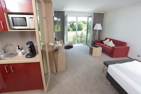 Deluxe Room, 1 Double Bed, Kitchenette | Private kitchen | Fridge, coffee/tea maker