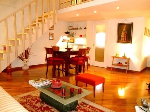 Spacious and comfortable living room with sofa bed, AC, Tv and dining table.