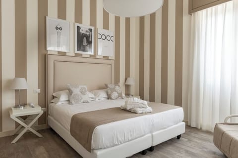 Double or Twin Room (Ground Floor) | Minibar, in-room safe, iron/ironing board, cribs/infant beds