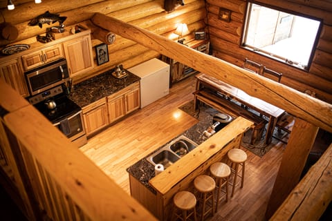 View of kitchen and dining area from loft