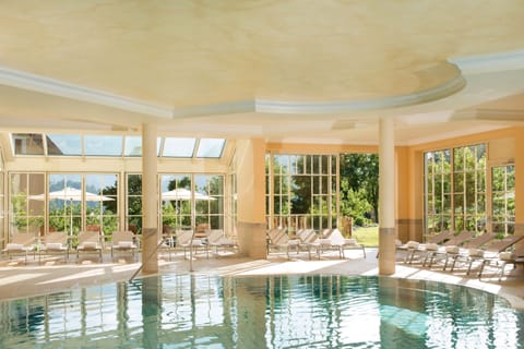 Indoor pool, open 7:00 AM to 9:00 PM, pool umbrellas, sun loungers