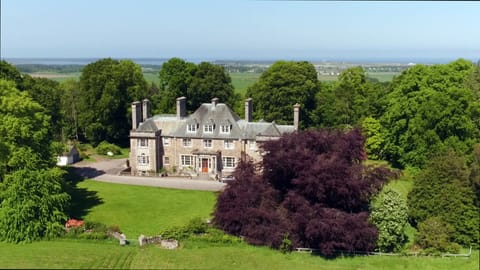 Burgie House from the front with Findhorn Bay & the stunning Moray Firth behind.