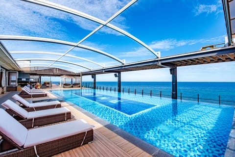 Outdoor pool, open 9:00 AM to 10:00 PM, cabanas (surcharge)