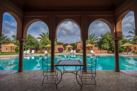 Outdoor pool, open 8 AM to 8 PM, pool umbrellas, sun loungers