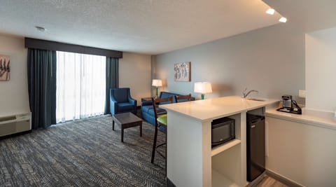 Suite, Multiple Beds, Non Smoking, Kitchenette (Walk-in Shower) | Desk, laptop workspace, blackout drapes, iron/ironing board