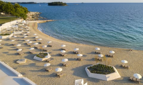 On the beach, sun loungers, beach umbrellas, beach towels