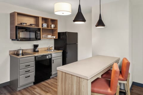 Suite, 1 Bedroom | Desk, laptop workspace, blackout drapes, iron/ironing board